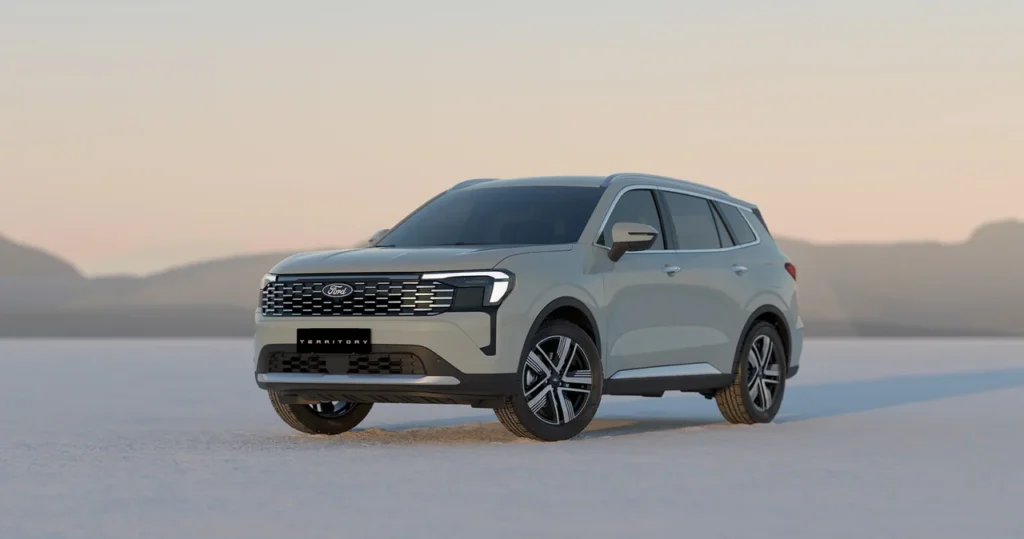 Novo Ford Territory 2026 tem novo visual revelado e estreia confirmada no Brasil 1 Vista frontal e lateral do Ford Territory em paisagem natural, com destaque para o design robusto e moderno do SUV
